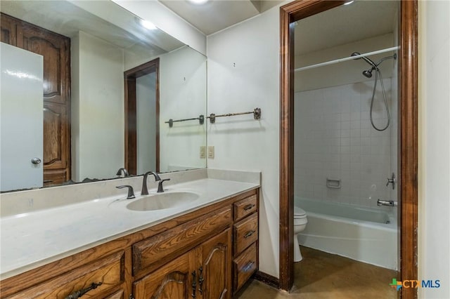 full bathroom with vanity, toilet, and tiled shower / bath combo