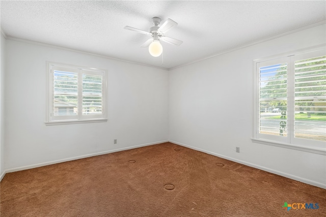 carpeted empty room with a textured ceiling, ceiling fan, and crown molding