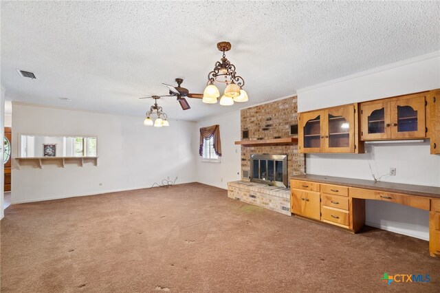 unfurnished living room featuring a brick fireplace, dark colored carpet, and a textured ceiling