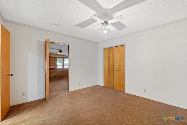 125 Hillview Dr, Luling, TX 78648 - unfurnished bedroom with ornamental molding, a textured ceiling, carpet, baseboards, and ceiling fan