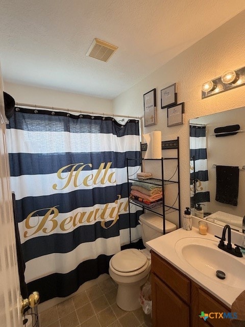 bathroom with curtained shower, vanity, and toilet