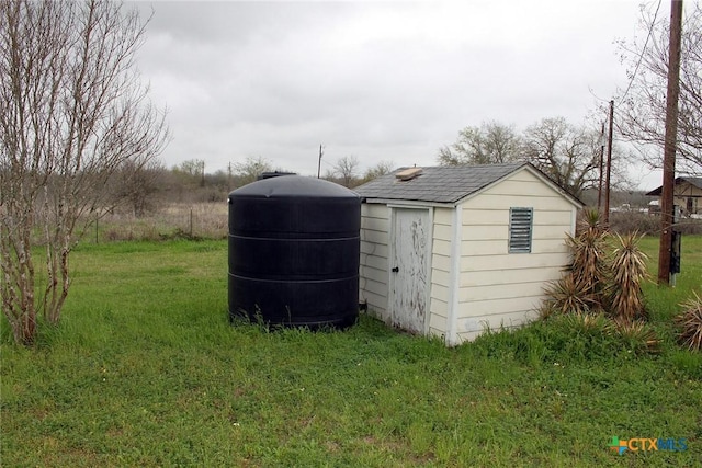 view of outdoor structure with a lawn