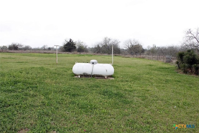 view of yard with a rural view