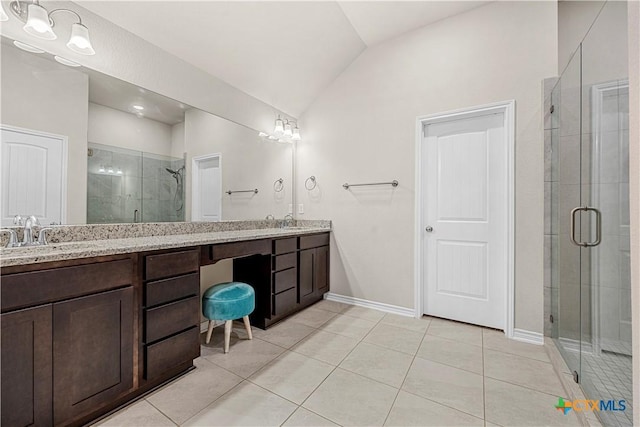 1527 Cobble Hill Ct, Temple, TX 76502 - bathroom featuring vaulted ceiling, a stall shower, double vanity, tile patterned flooring, and baseboards