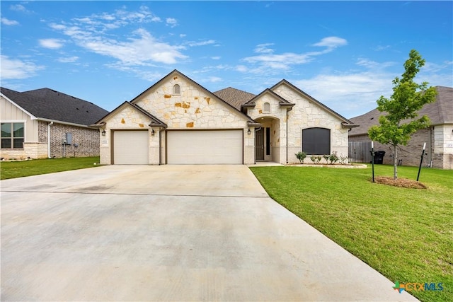 1527 Cobble Hill Ct, Temple, TX 76502 - french country style house featuring a garage, concrete driveway, and stone siding