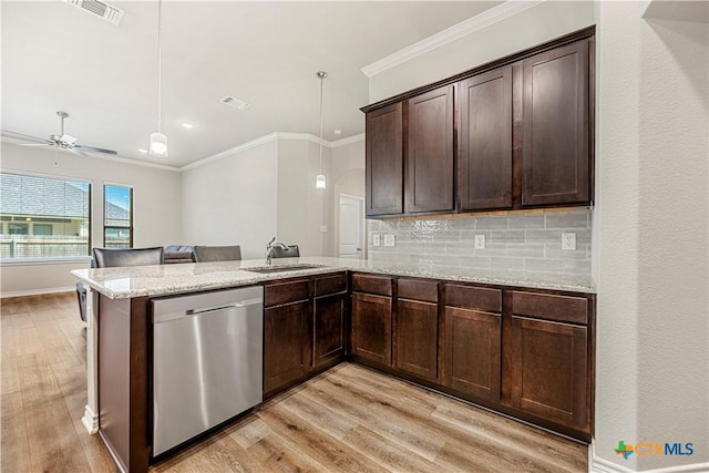 1527 Cobble Hill Ct, Temple, TX 76502 - kitchen featuring dishwasher, a sink, light wood-type flooring, a peninsula, and ornamental molding