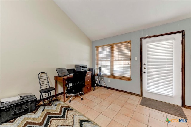 office with light tile patterned flooring, vaulted ceiling, and baseboards