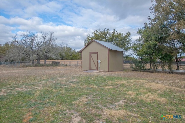 view of shed with fence