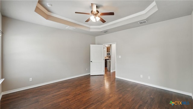 7881 Wegner Rd, New Braunfels, TX 78132 - empty room featuring a tray ceiling, ceiling fan, crown molding, wood finished floors, and baseboards