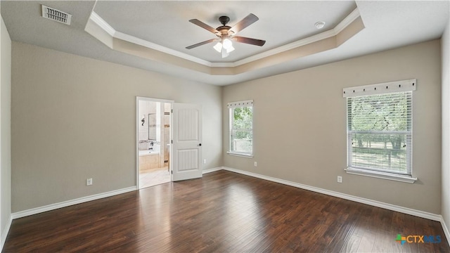 7881 Wegner Rd, New Braunfels, TX 78132 - unfurnished room with a tray ceiling, crown molding, wood finished floors, a ceiling fan, and baseboards