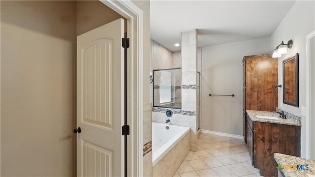 7881 Wegner Rd, New Braunfels, TX 78132 - bathroom with a tile shower, vanity, a bath, tile patterned flooring, and baseboards