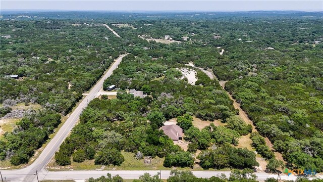 7881 Wegner Rd, New Braunfels, TX 78132 - aerial overview of property's location with a heavily wooded area
