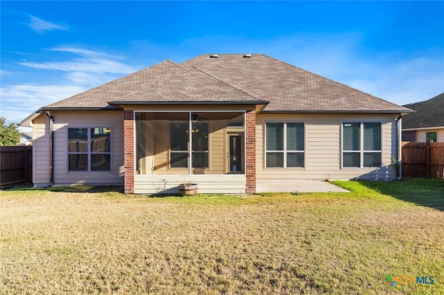 rear view of house with a lawn