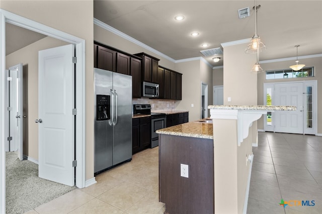 kitchen with crown molding, hanging light fixtures, light colored carpet, and stainless steel appliances