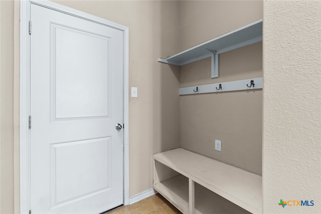 mudroom featuring light tile patterned flooring