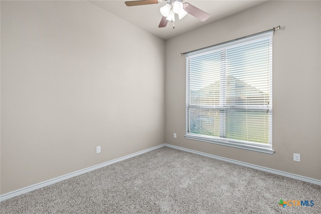 carpeted empty room featuring ceiling fan