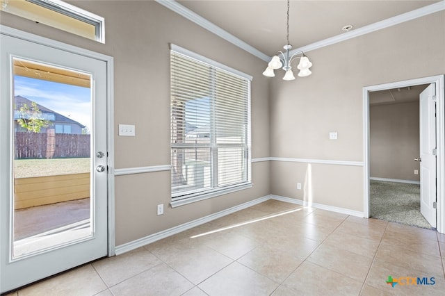 unfurnished dining area featuring ornamental molding, light tile patterned floors, a healthy amount of sunlight, and a notable chandelier