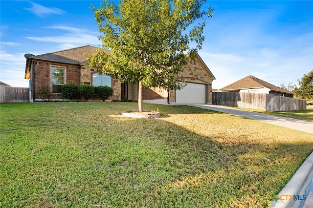 view of front of property featuring a garage and a front lawn