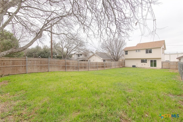 view of yard with a fenced backyard