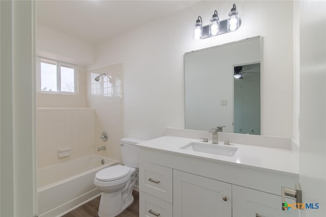 bathroom with shower / tub combination, toilet, vanity, and wood finished floors