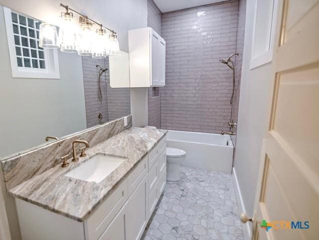 608 N Clinton St, Cuero, TX 77954 - full bathroom featuring vanity, shower / bathtub combination, and tile patterned floors
