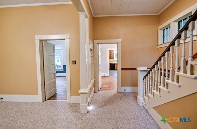 608 N Clinton St, Cuero, TX 77954 - entryway with ornamental molding, carpet flooring, and stairs