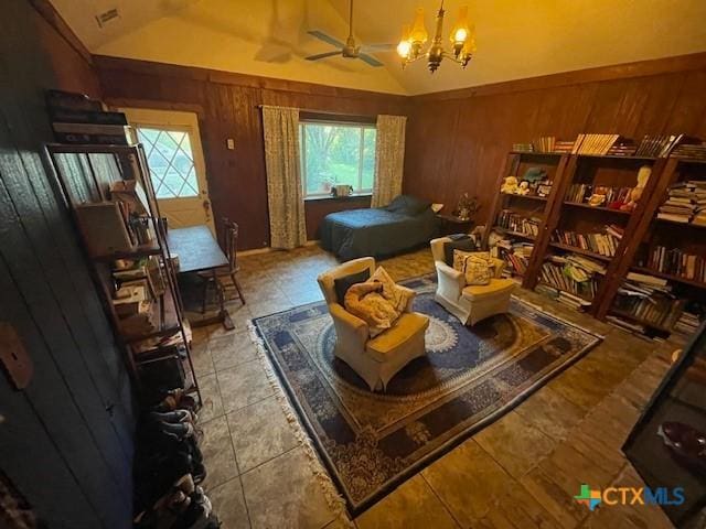 20655 State Highway 195, Killeen, TX 76542 - bedroom featuring vaulted ceiling, a chandelier, wooden walls, light tile patterned flooring, and visible vents