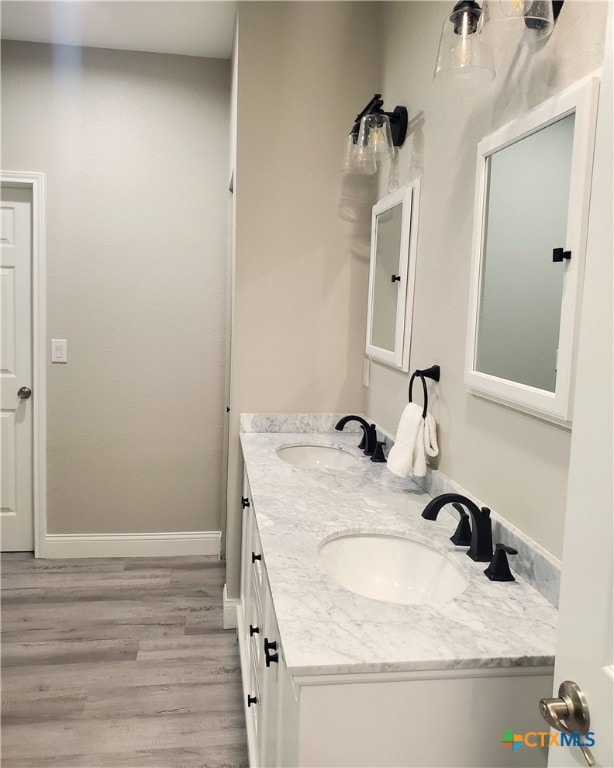 bathroom featuring hardwood / wood-style floors and vanity