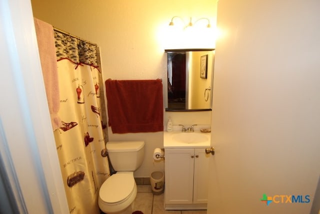 bathroom featuring tile patterned flooring, vanity, toilet, and a shower with shower curtain