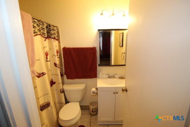 2305 Chestnut Dr, Killeen, TX 76543 - full bath with toilet, vanity, tile patterned flooring, and a shower with shower curtain