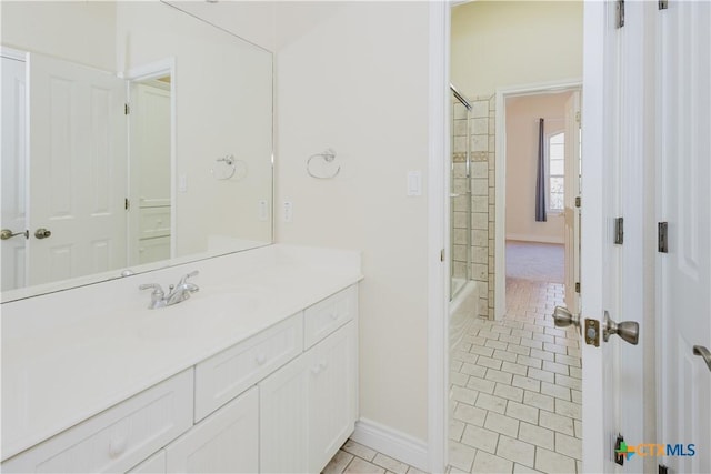 bathroom featuring tile patterned flooring, vanity, and tiled shower / bath combo