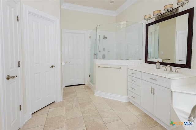 bathroom with tile patterned floors, ornamental molding, an enclosed shower, and vanity