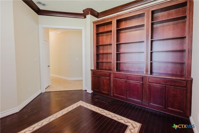 unfurnished office featuring ornamental molding and dark hardwood / wood-style floors