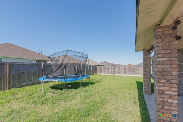 view of yard featuring a trampoline