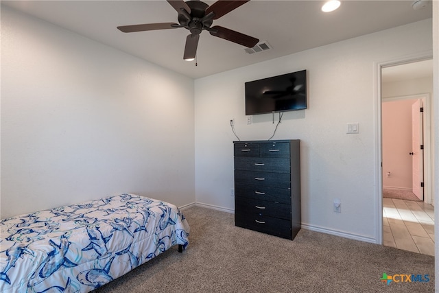 bedroom featuring light carpet and ceiling fan