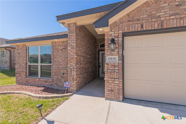 property entrance with a garage