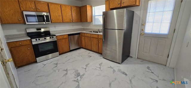 kitchen featuring sink, a healthy amount of sunlight, and appliances with stainless steel finishes