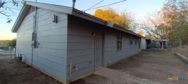 view of property exterior at dusk