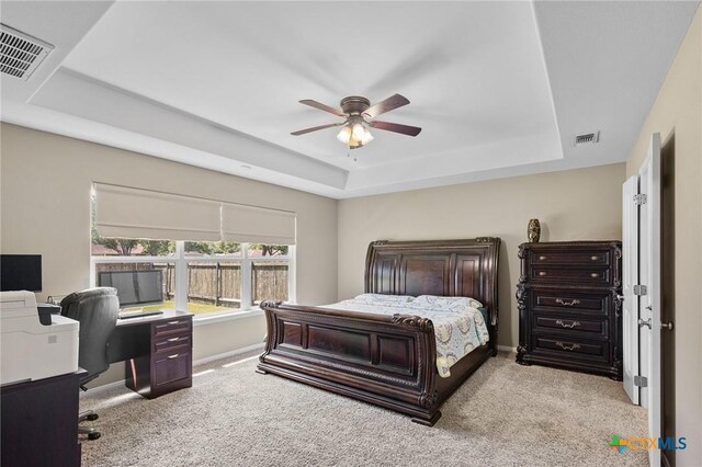 203 Terravista Trl, Victoria, TX 77904 - bedroom featuring a raised ceiling, light colored carpet, and an office area