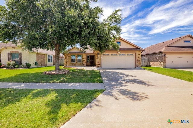 203 Terravista Trl, Victoria, TX 77904 - ranch-style house featuring a garage, concrete driveway, a front yard, and brick siding