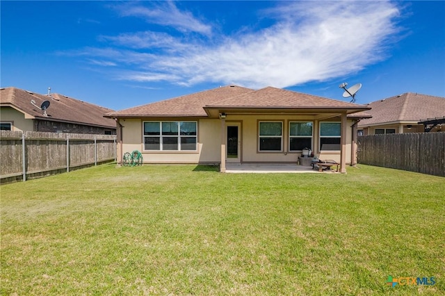 203 Terravista Trl, Victoria, TX 77904 - rear view of property featuring a patio area, stucco siding, and a shingled roof