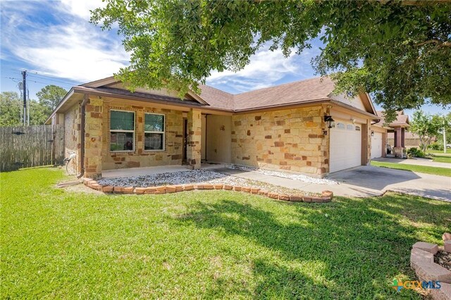 203 Terravista Trl, Victoria, TX 77904 - ranch-style home featuring stone siding, a garage, and driveway
