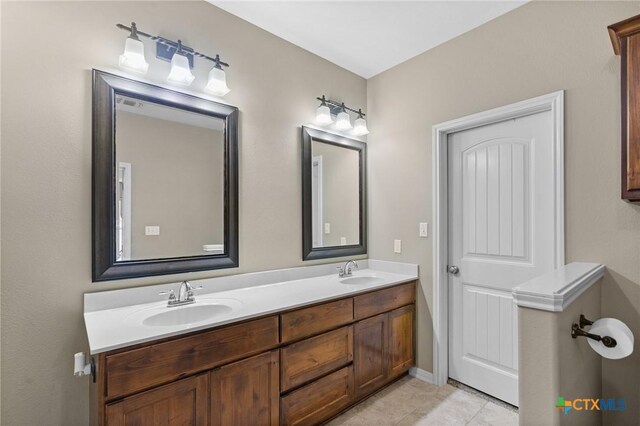 203 Terravista Trl, Victoria, TX 77904 - bathroom featuring double vanity and tile patterned floors