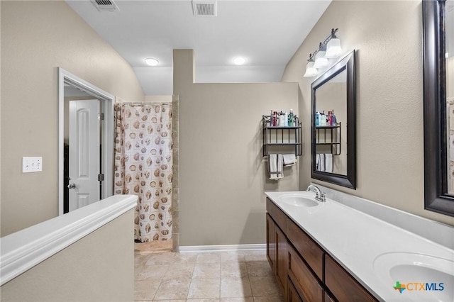 203 Terravista Trl, Victoria, TX 77904 - bathroom with double vanity, a shower with curtain, and tile patterned flooring
