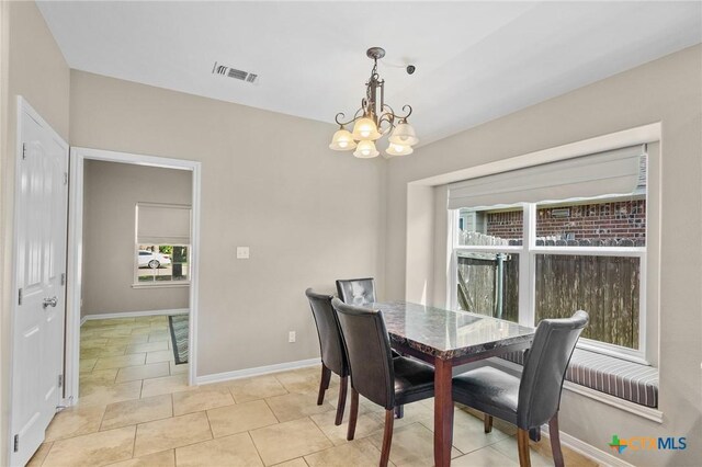 203 Terravista Trl, Victoria, TX 77904 - dining area with a chandelier, baseboards, and light tile patterned floors