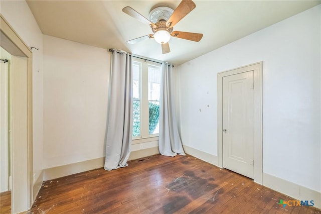 spare room featuring ceiling fan and hardwood / wood-style floors