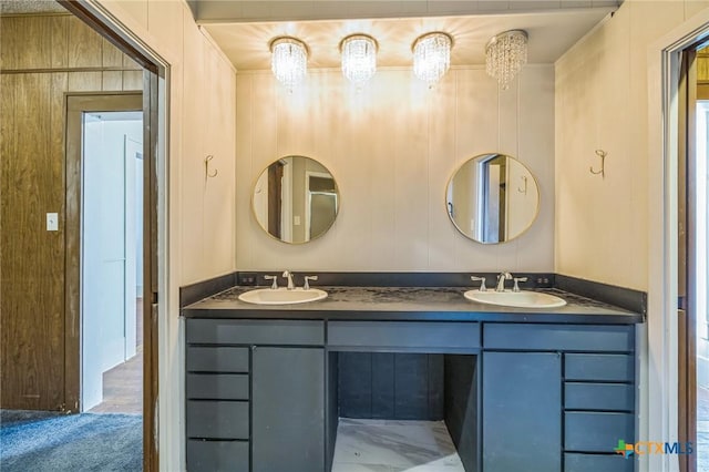 bathroom with a sink and double vanity