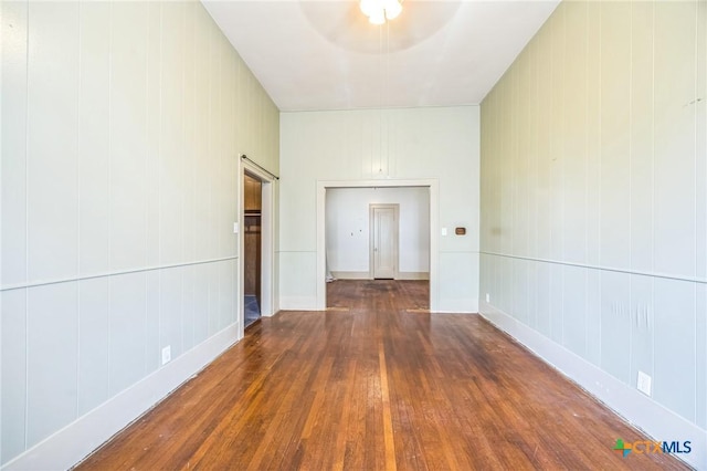 spare room with hardwood / wood-style floors