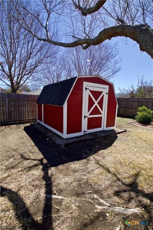 view of shed with a fenced backyard