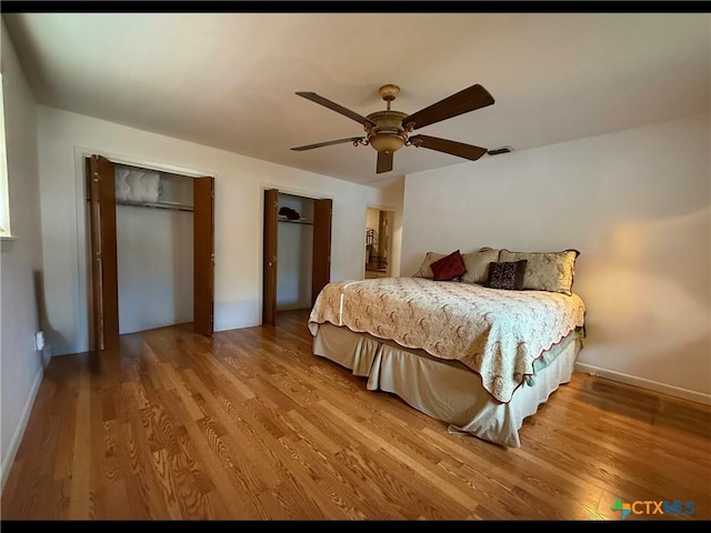 105 Brentwood Pl, Port Lavaca, TX 77979 - bedroom featuring wood finished floors, two closets, and ceiling fan